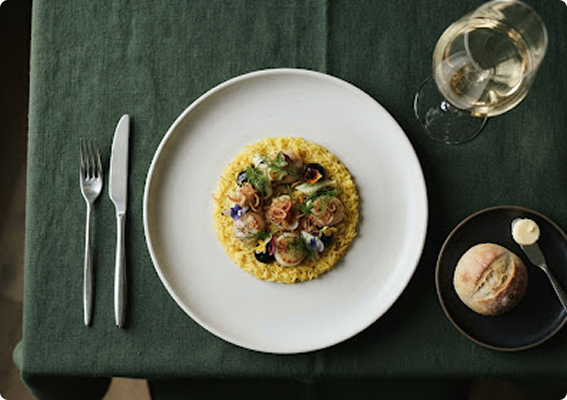 Plated risotto dish served in a fine-dining setting